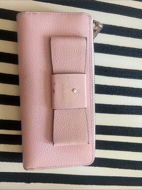 kate spade pink bow zip-around wallet